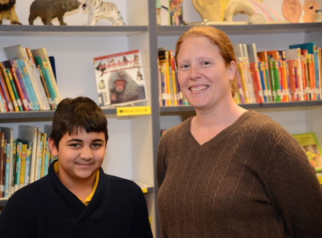 Fifth grader Riya Ahad poses with his teacher Michelle Lynd
